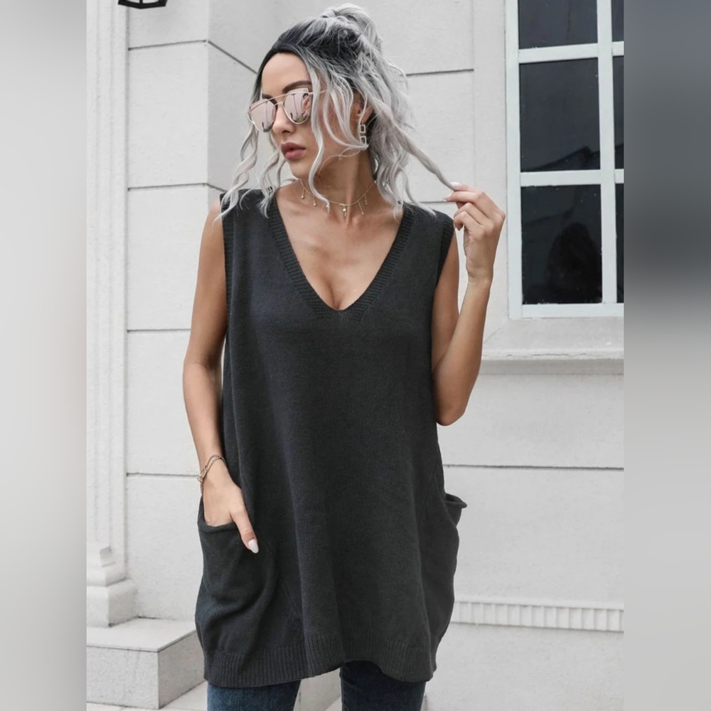 Brand new Edgy black sleeveless sweater with pockets!